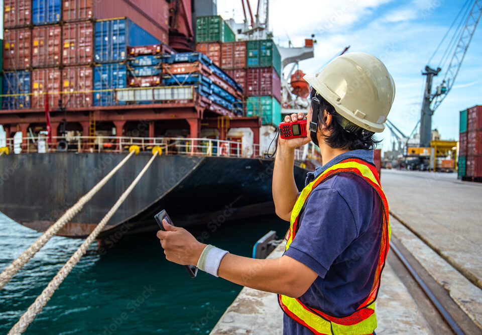 loading master, harbor controller in charge of containers shipment in port terminal, command by walkie talkie radio, communication online and swift report, the services logistics and transportation